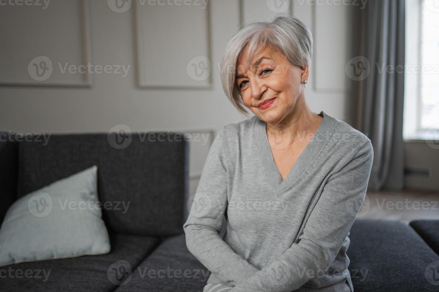 Portrait of confident stylish european middle aged senior woman. Older mature 60s lady smiling at home. Happy attractive senior female looking camera close up face headshot portrait. Happy people photo