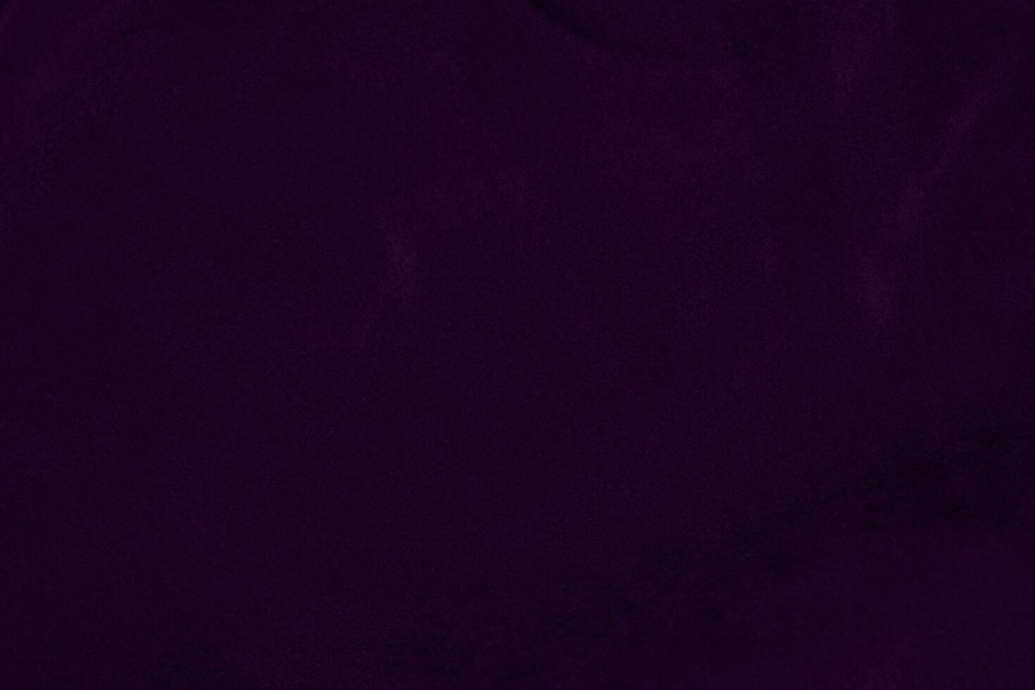 Dark purple velvet fabric texture used as background. violet color purple fabric background of soft and smooth textile material. crushed velvet .luxury dark tone for silk. photo