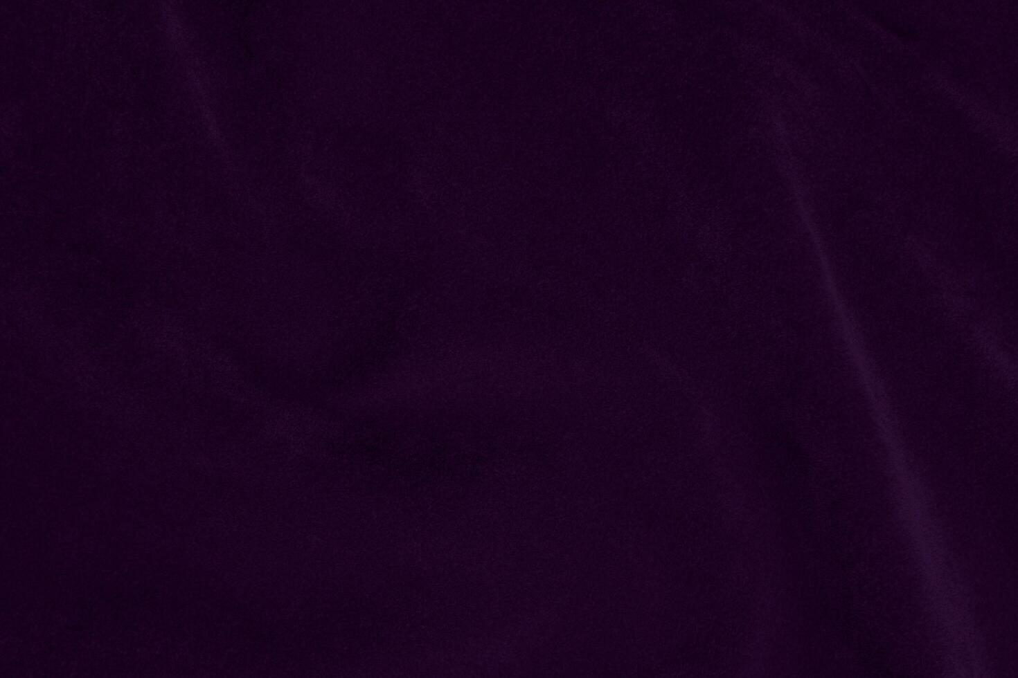 Dark purple velvet fabric texture used as background. violet color purple fabric background of soft and smooth textile material. crushed velvet .luxury dark tone for silk. photo