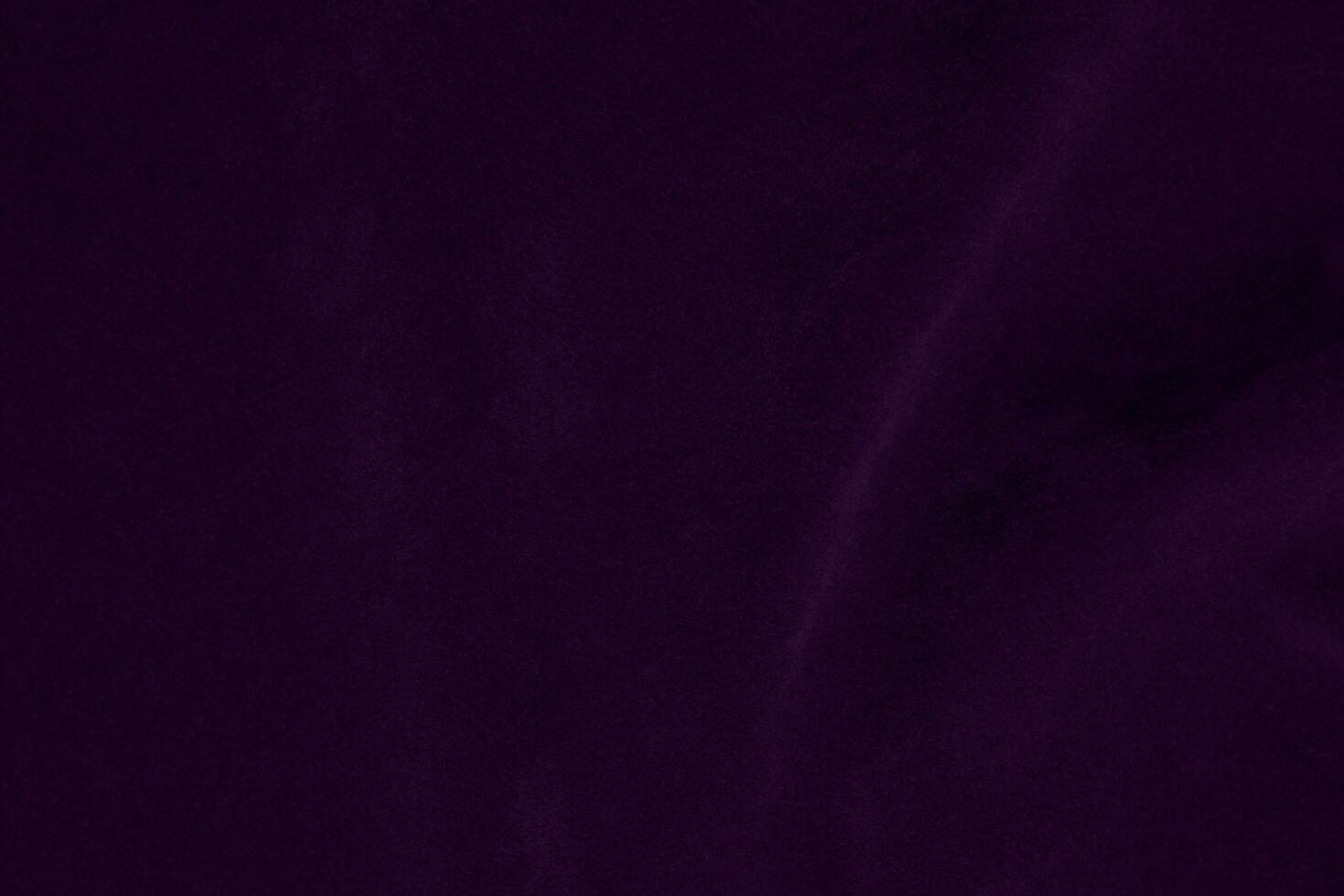 Dark purple velvet fabric texture used as background. violet color purple fabric background of soft and smooth textile material. crushed velvet .luxury dark tone for silk. photo