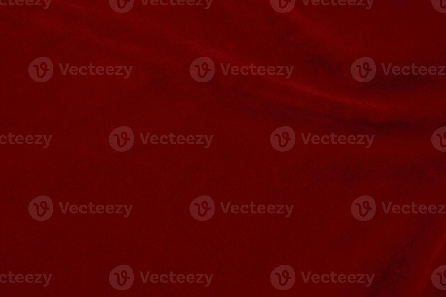 Dark red velvet fabric texture used as background. silk color scarlet fabric background of soft and smooth textile material. crushed velvet .luxury dark tone for silk. photo