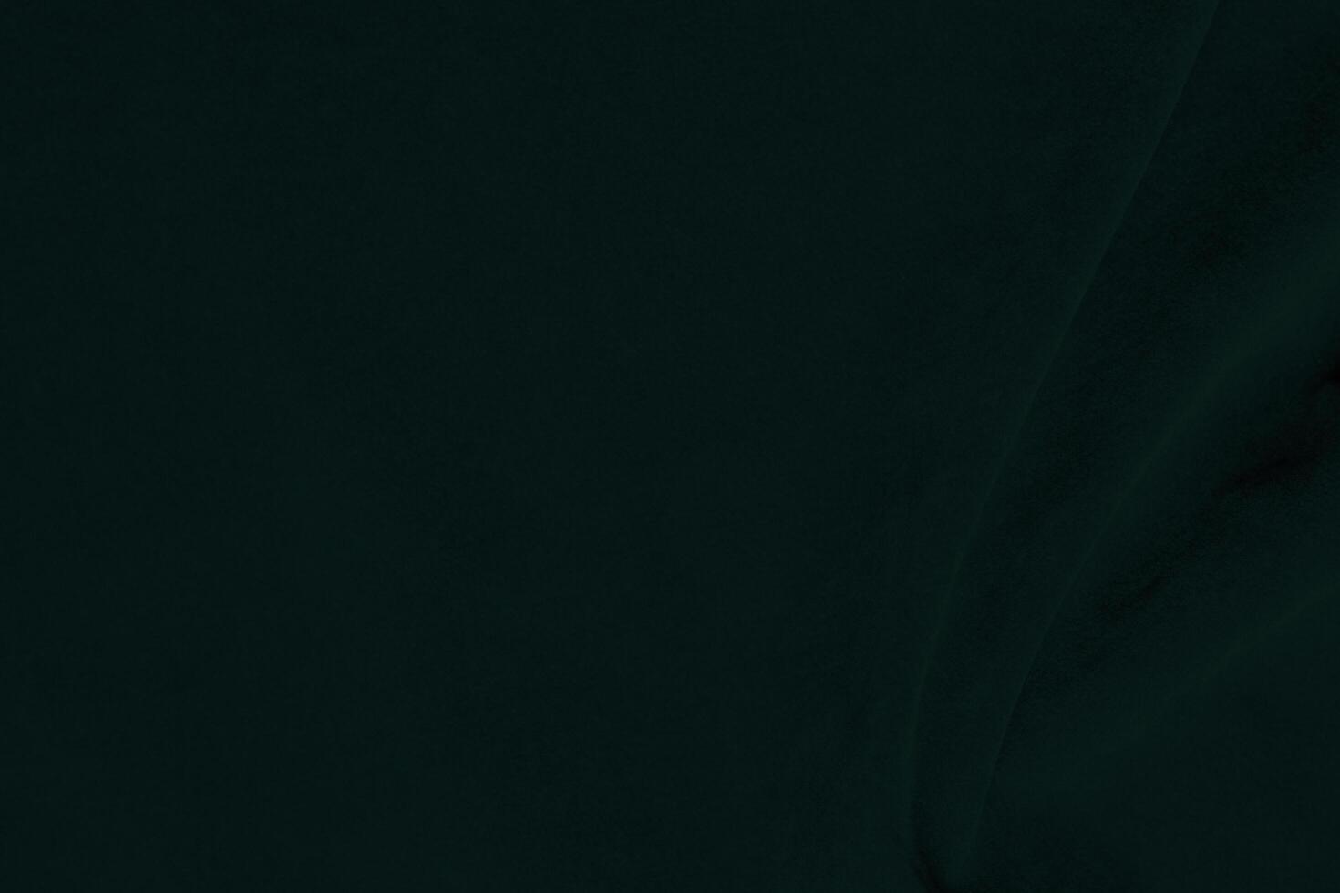 Green velvet fabric texture used as background. Emerald color panne fabric background of soft and smooth textile material. crushed velvet .luxury emerald tone for silk.. photo