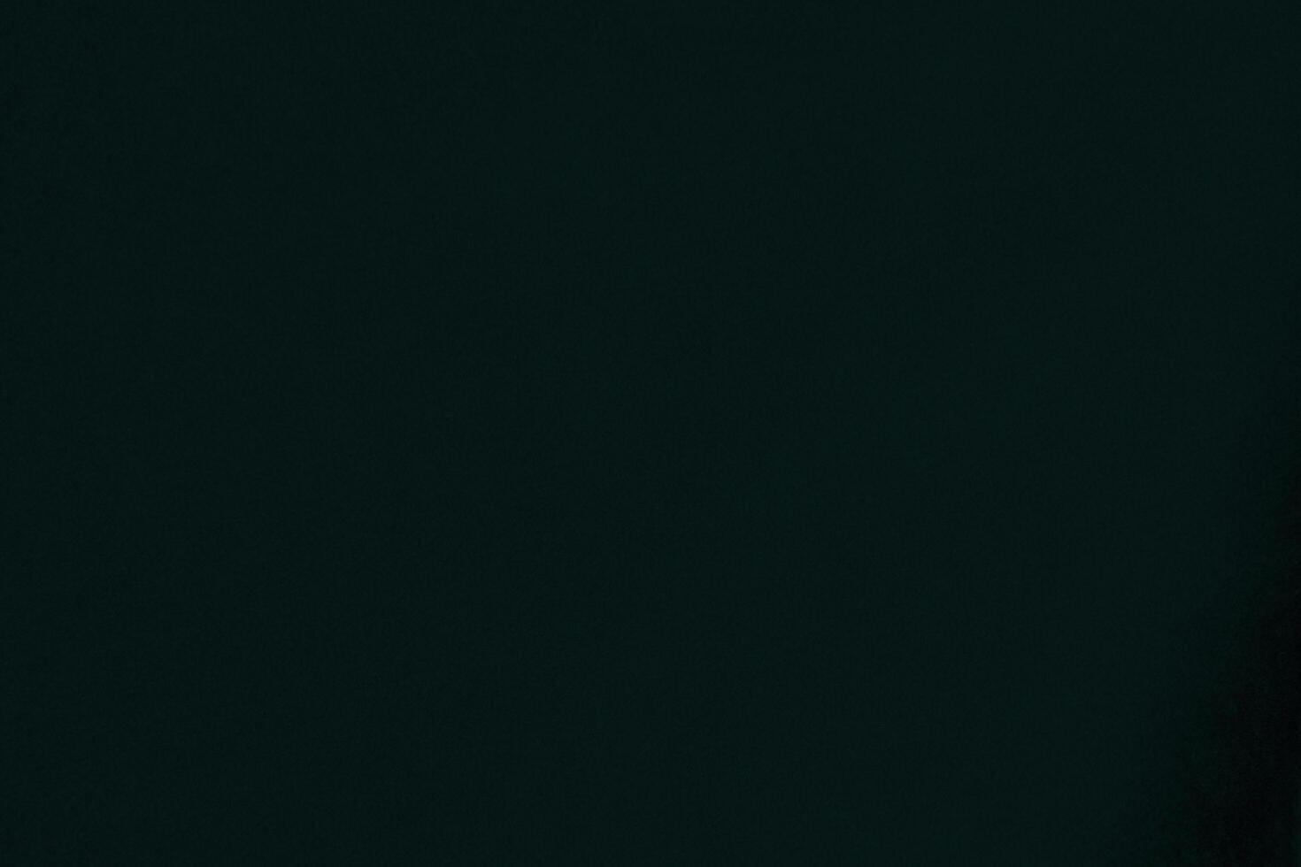 Green velvet fabric texture used as background. Emerald color panne fabric background of soft and smooth textile material. crushed velvet .luxury emerald tone for silk.. photo
