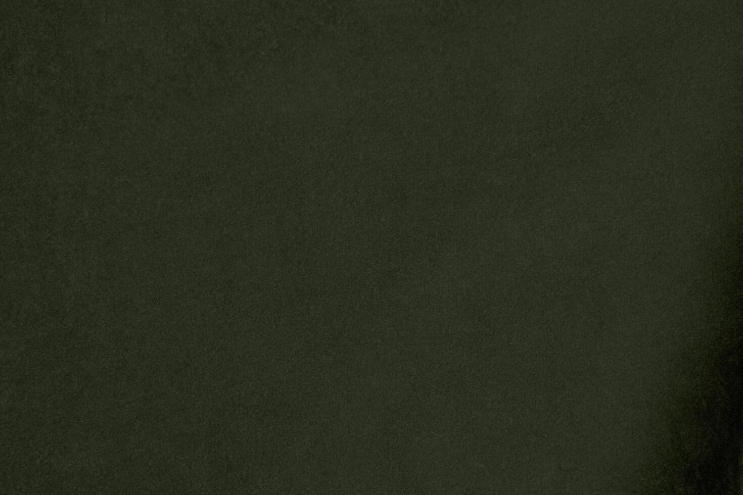 Silk olive green velvet fabric texture used as background. Emerald army color  fabric background of soft and smooth textile material. crushed velvet .luxury oil green tone for silk. photo