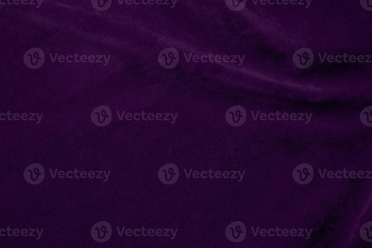 Dark purple velvet fabric texture used as background. violet color purple fabric background of soft and smooth textile material. crushed velvet .luxury dark tone for silk. photo