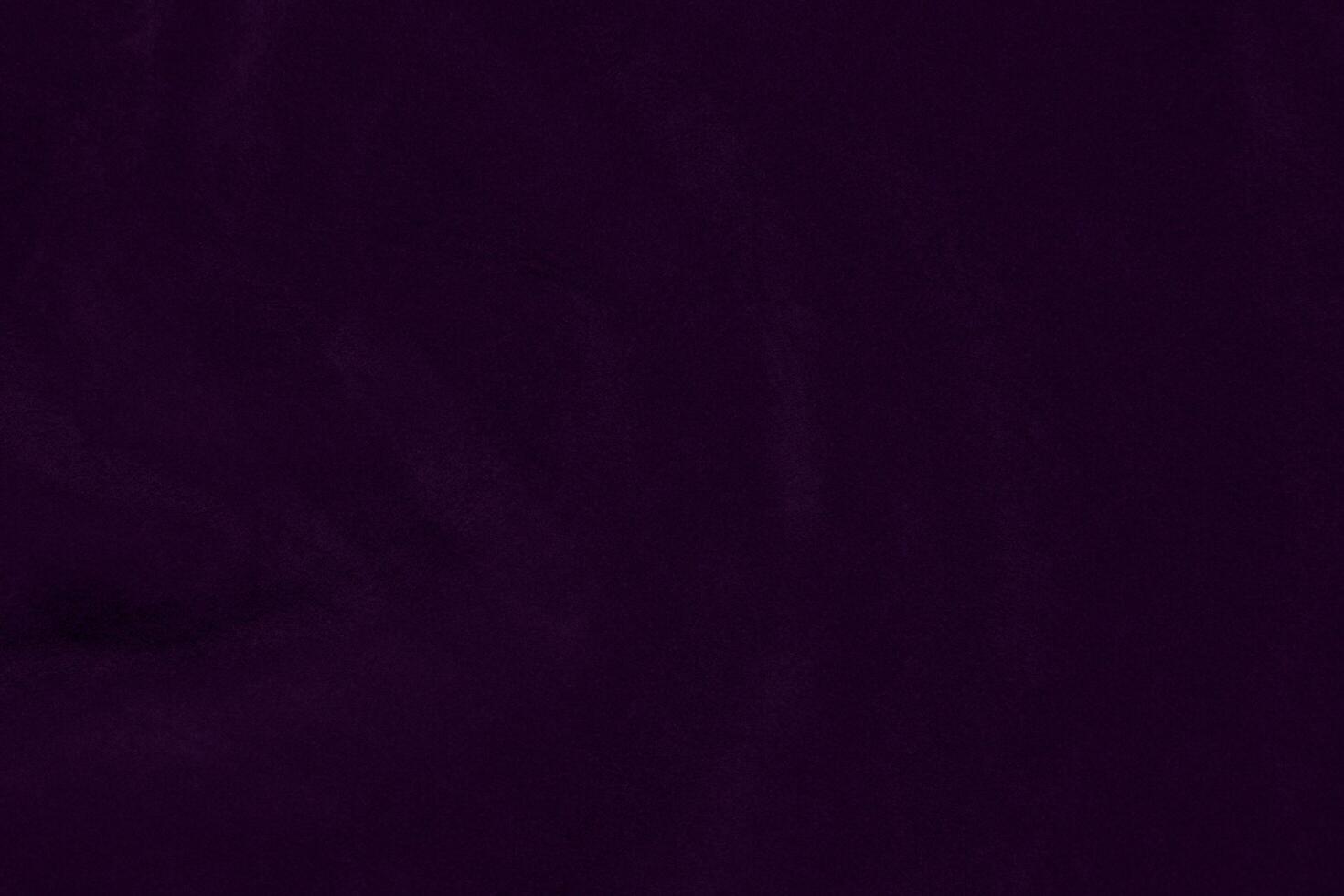 Dark purple velvet fabric texture used as background. violet color purple fabric background of soft and smooth textile material. crushed velvet .luxury dark tone for silk. photo