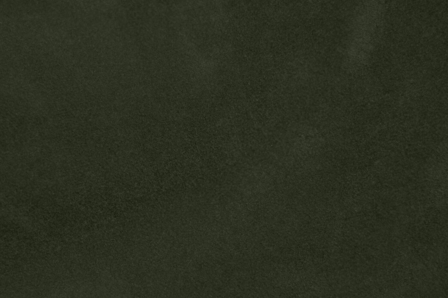 Silk olive green velvet fabric texture used as background. Emerald army color  fabric background of soft and smooth textile material. crushed velvet .luxury oil green tone for silk. photo