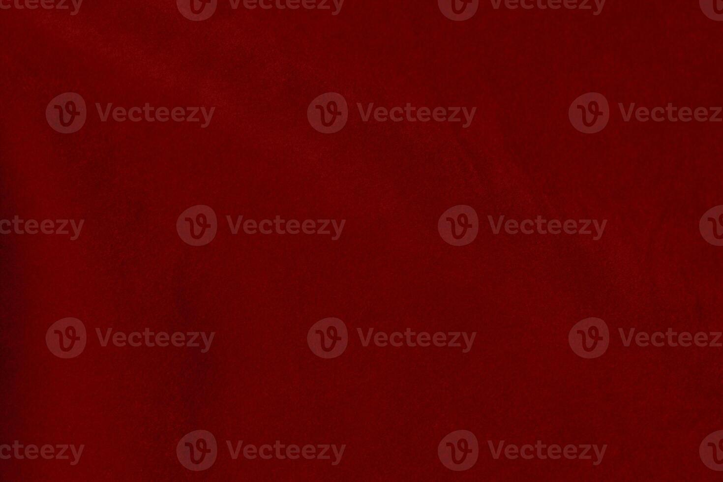 Dark red velvet fabric texture used as background. silk color scarlet fabric background of soft and smooth textile material. crushed velvet .luxury dark tone for silk. photo