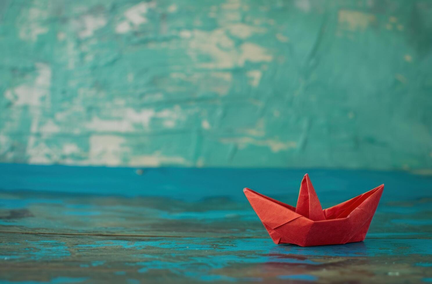 ai generado un pequeño papel barco con rojo vela en de madera cubierta foto