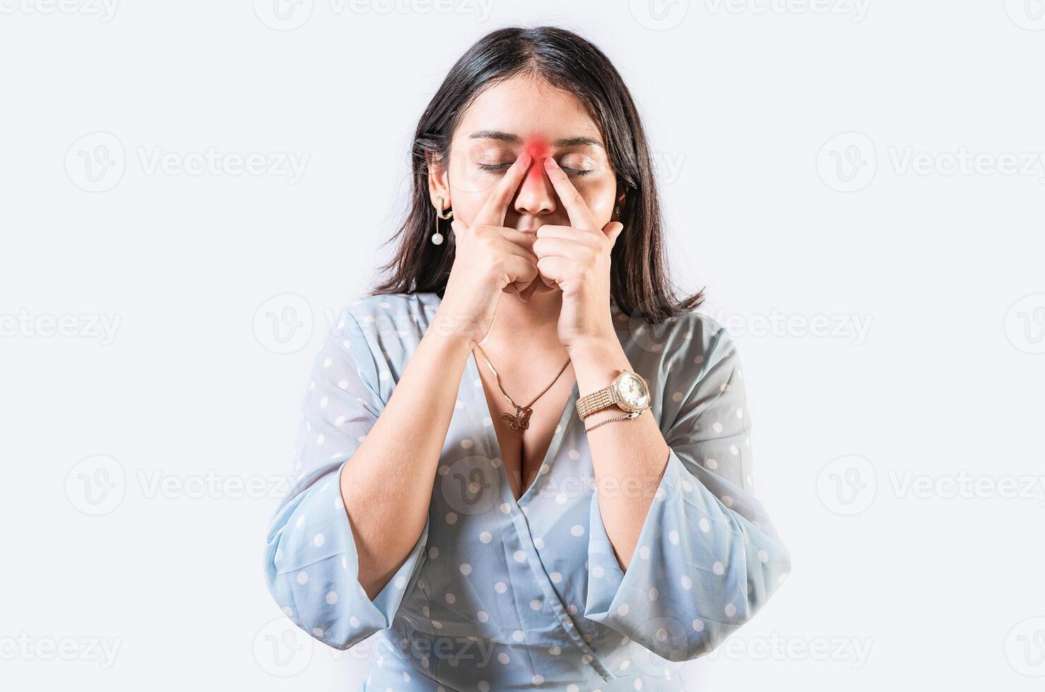 Girl with nasal bridge headache. Sinus pain concept. Young woman with pain touching nose. Person with nasal bridge pain photo