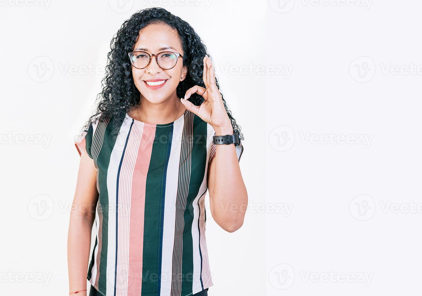 Positive afro woman showing ok gesture isolated. Smiling afro girl gesturing ok approved isolated photo