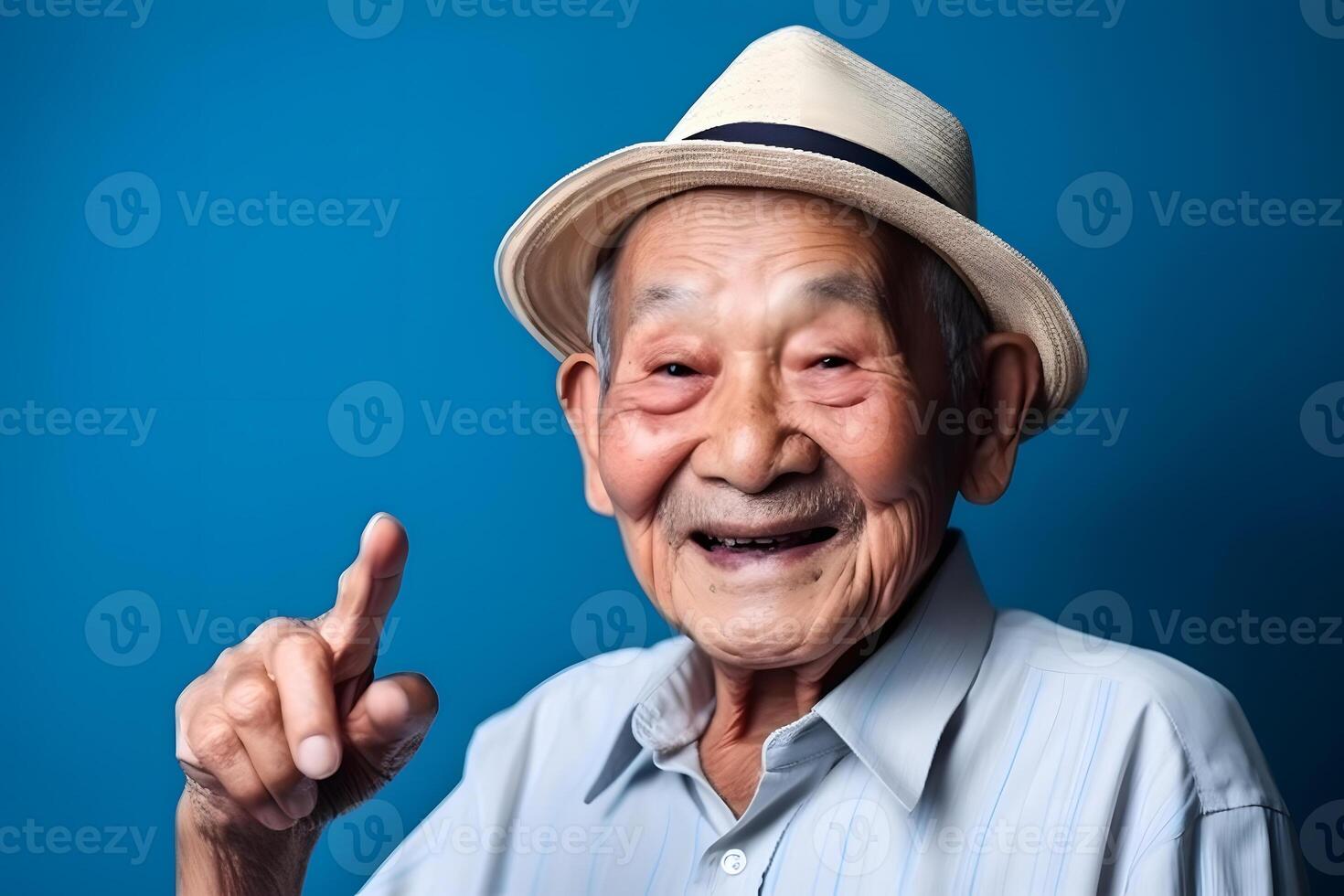 AI generated Asian grandfather looking and smiling with rised index finger on blue background, neural network generated art photo