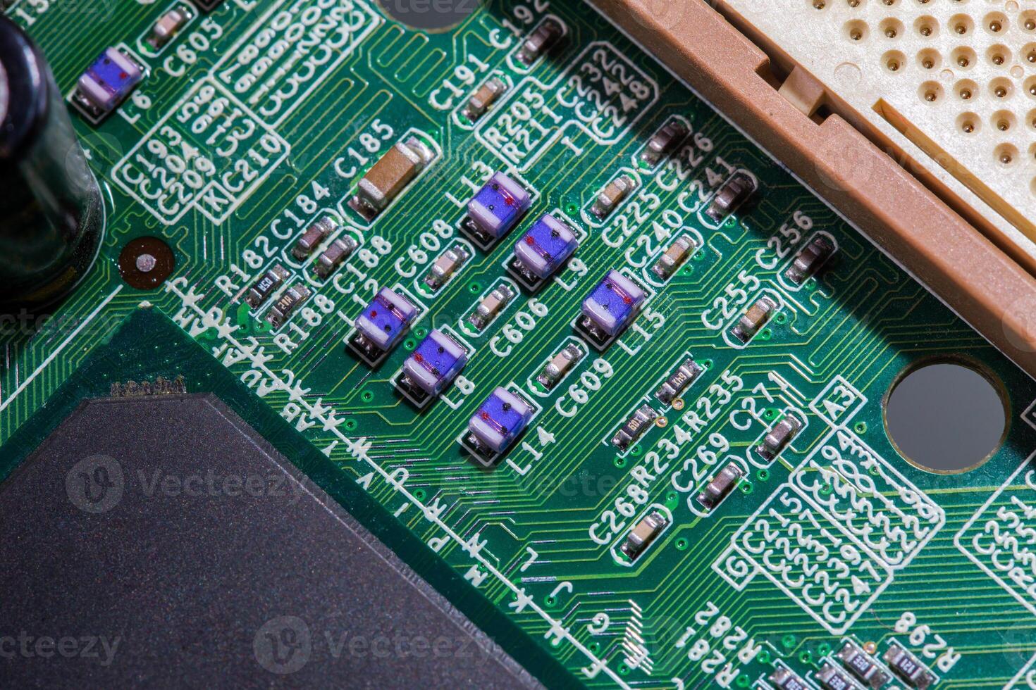 old digital circuit board with microprocessors and components, closeup full-frame macro background photo