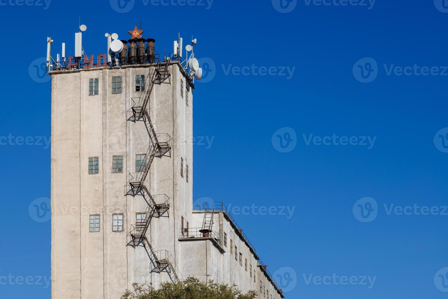 telecommunication antennas on top of old soviet elevator tower photo