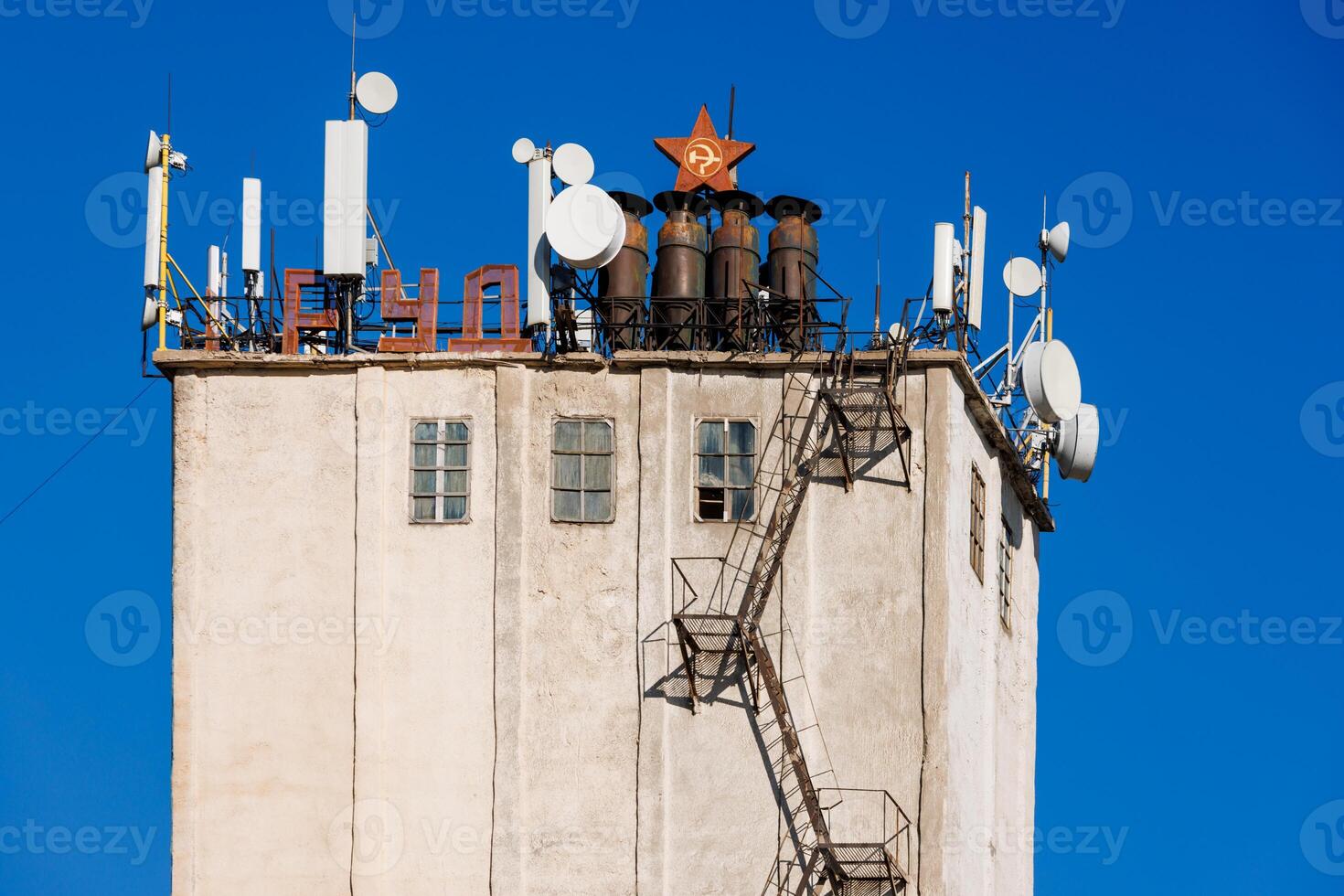 telecommunication antennas on top of old soviet elevator tower photo