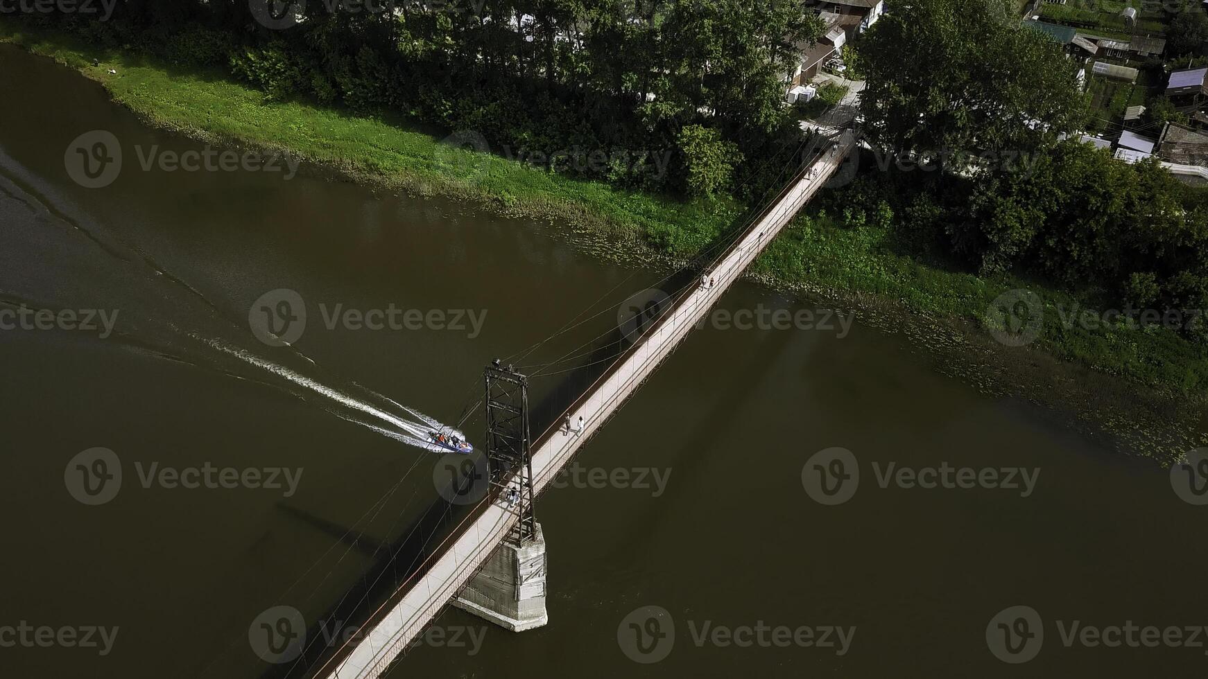 The bridge over the river. Clip. Car traffic on the bridge, iew from the top. photo