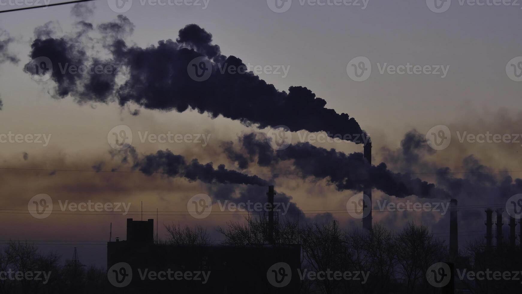 Smoking factory chimneys. Environmental problem of pollution of environment and air in large cities. View of large plant with Smoking pipes. Timelapse photo