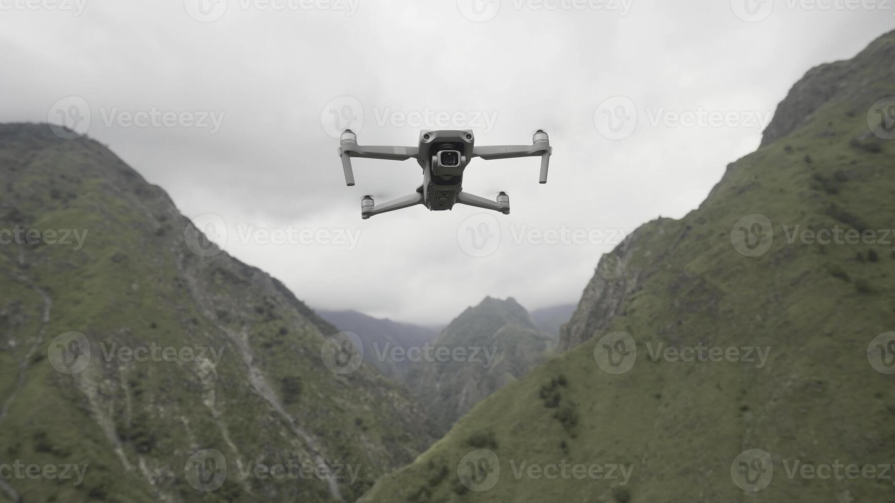 Aerial drone scenery of green mountain landscape. Action. Fantastic wild rocks and picturesque slopes on a summer day with flying quadrocopter. photo