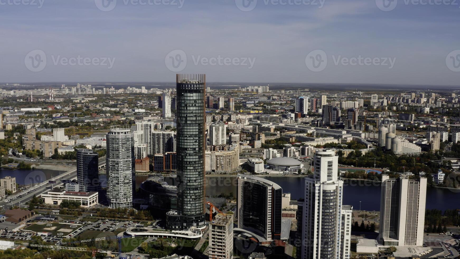 A big city with an embankment and a river. Stock footage. Bird's-eye view of tall office and residential buildings in the Art Nouveau style and the embankment for tourist walks. photo