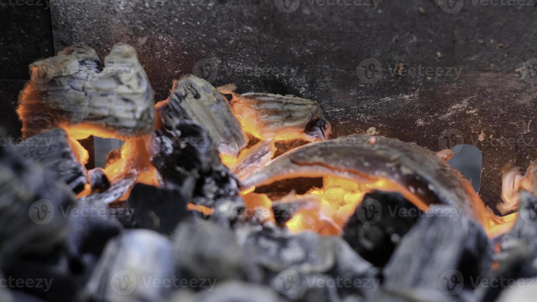 Burning coals. Concept. Burnt coals that burn and smoke. photo