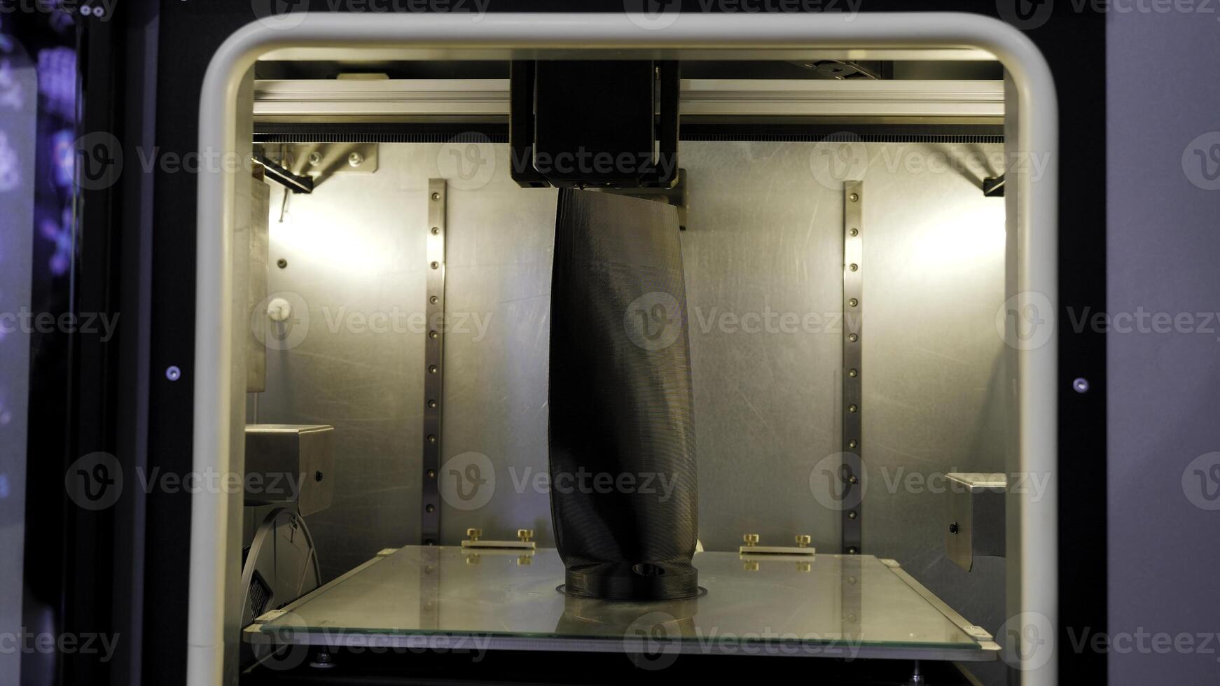 Large 3d printer. Media.A huge 3D printing machine with internal illumination. photo