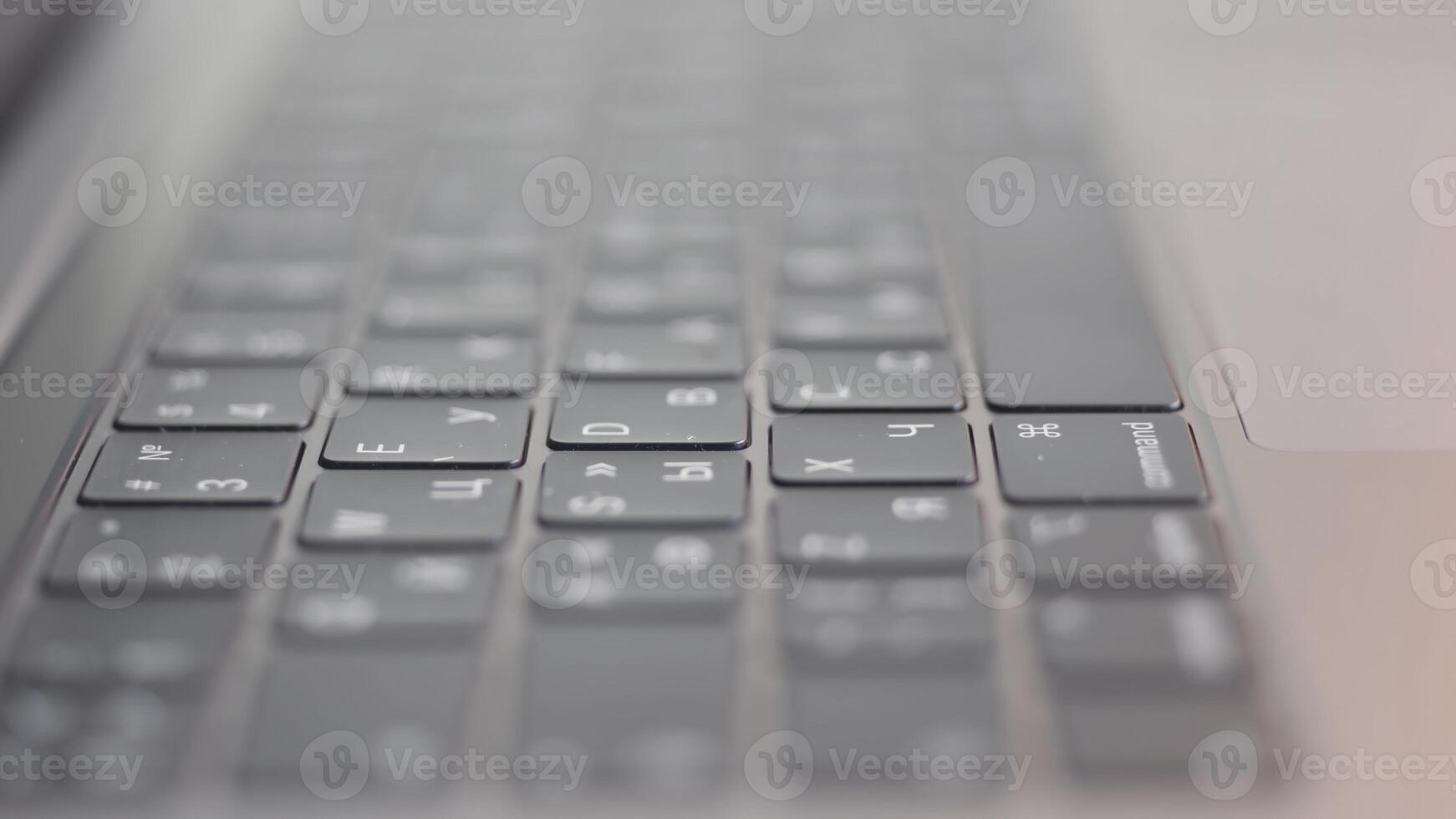 Close up of computer black keyboard. Action. Technological background with the new modern flat keypad of the laptop. photo