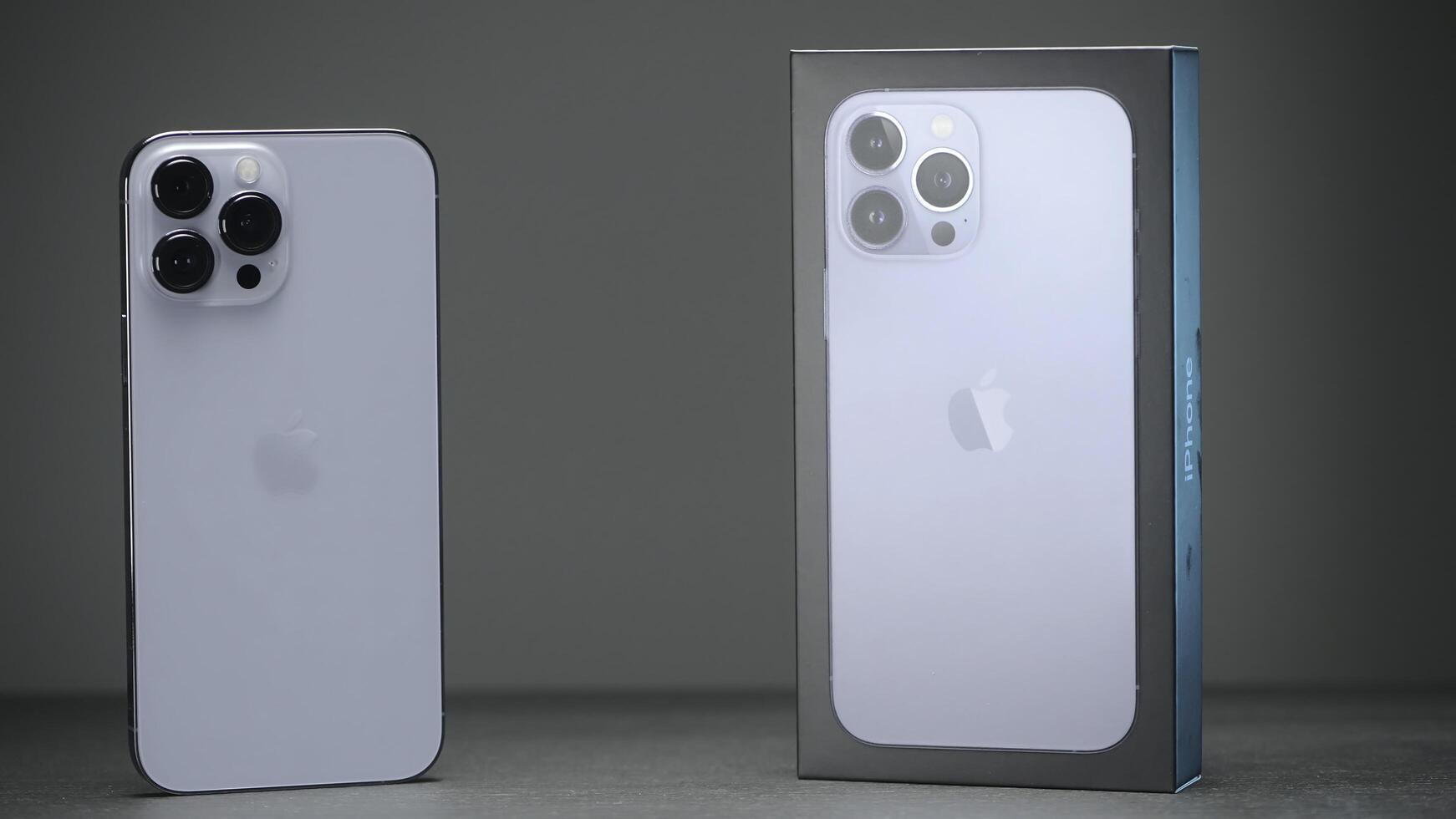 RUSSIA, MOSCOW - SEPTEMBER 27, 2021. Unpacking new iPhone. Action. Purchase of new iPhone 13 pro from Apple. Luxury iPhone with three cameras in new configuration photo