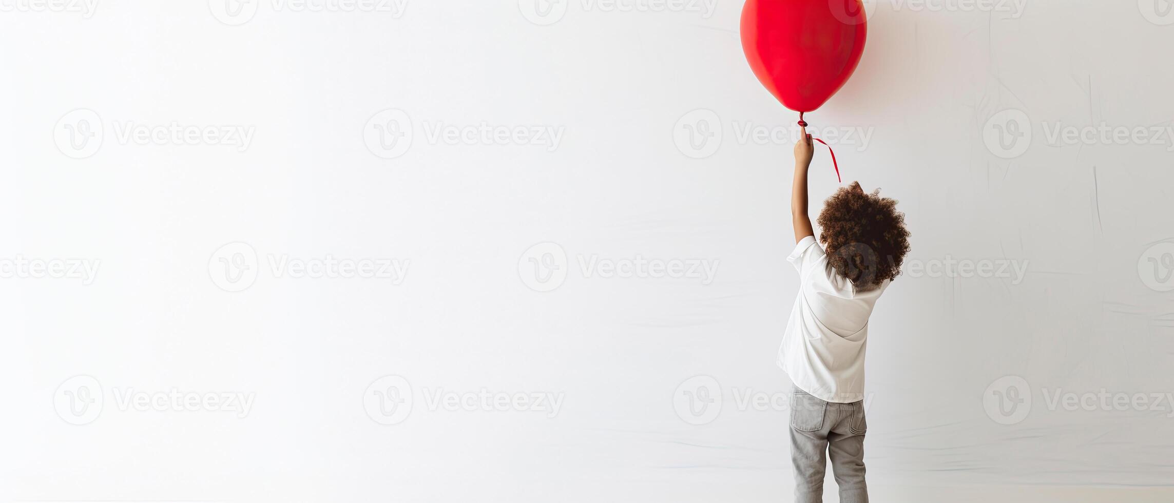 AI generated Back view of a kid raising arms with red love valentine heart shaped balloon isolated on white background photo