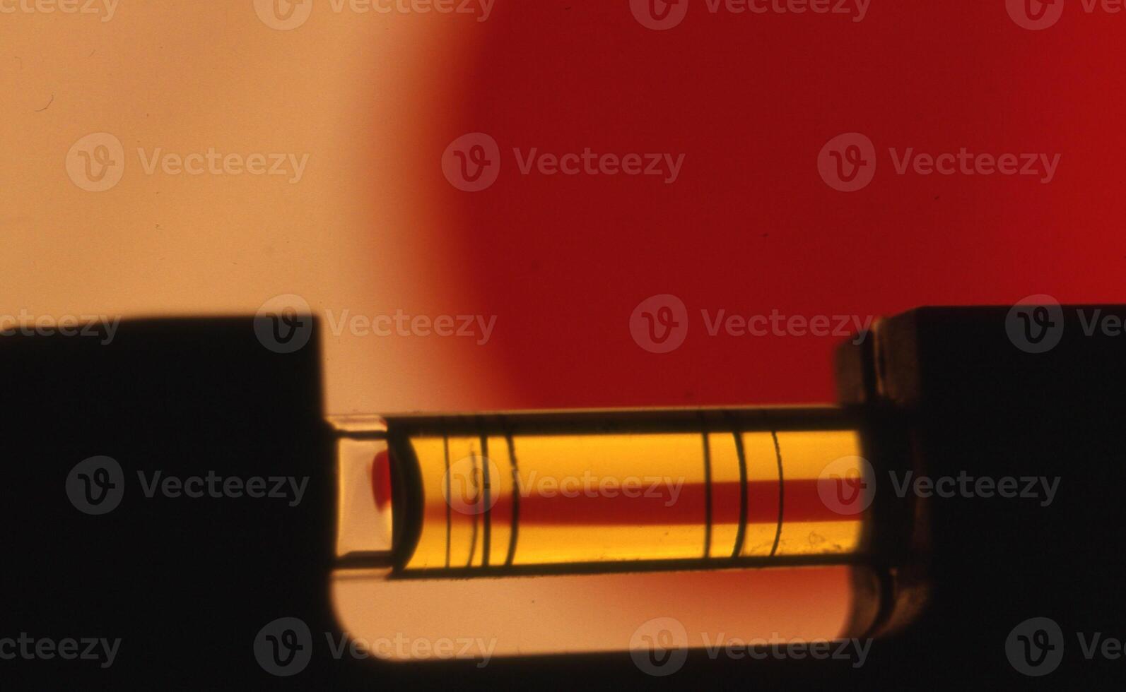 a close up of a tube with a red and yellow background photo