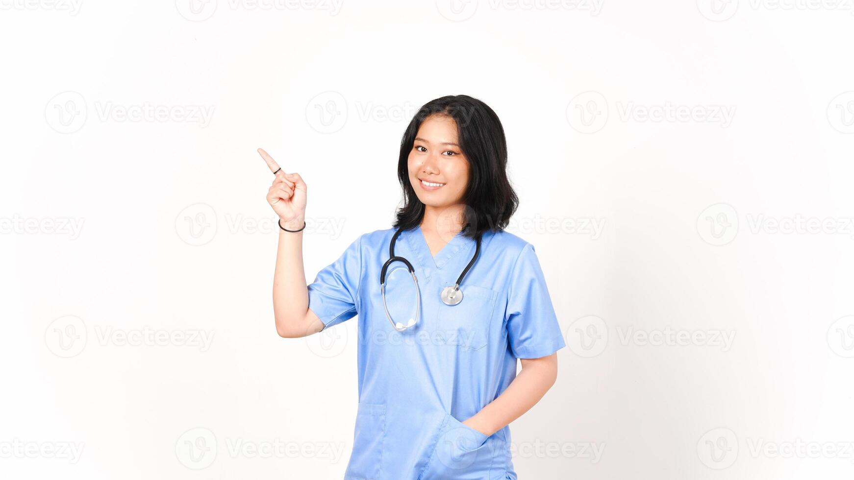 Young Asian female doctor pointing side copy space isolated on white background photo