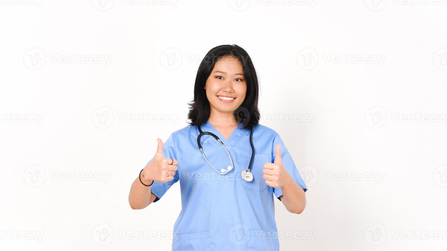 Young Asian female doctor showing thumbs up isolated on white background photo