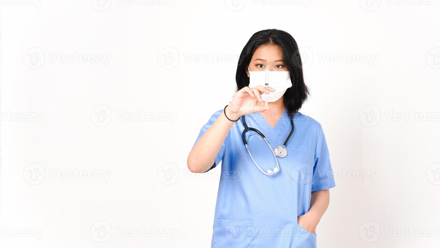 Young Asian female doctor wearing medical mask and holding syringe for vaccination isolated on white background photo