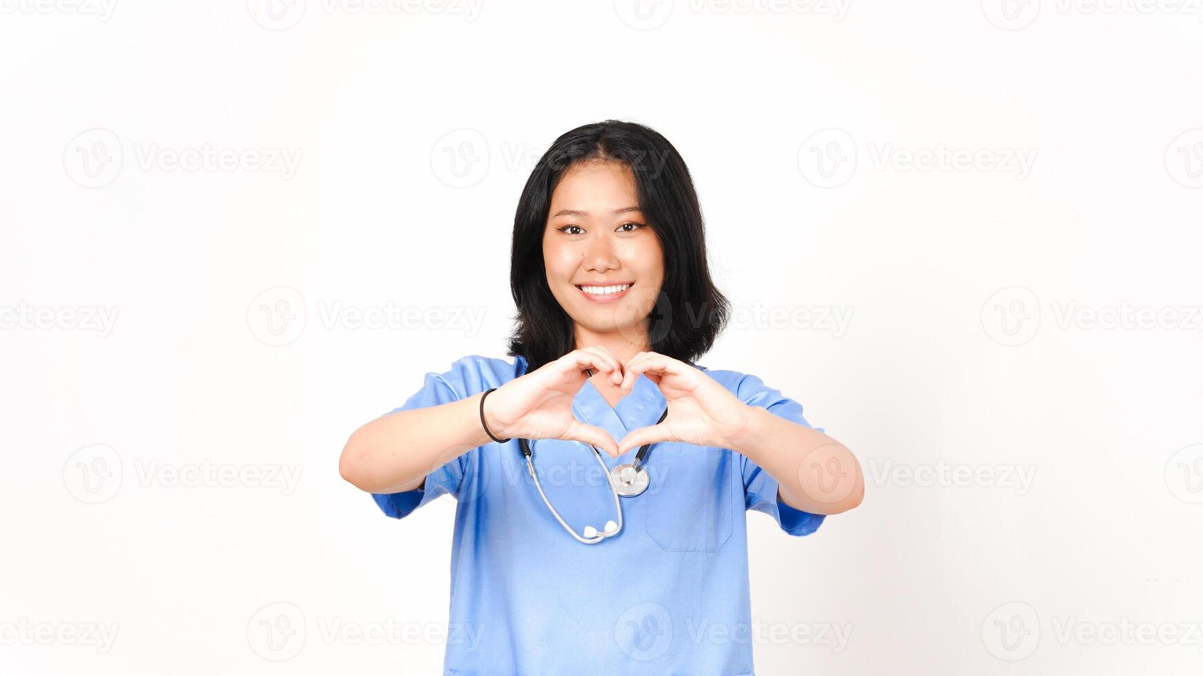 Young Asian female doctor showing love sign isolated on white background photo