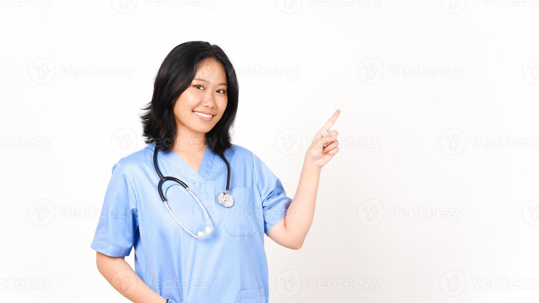 Young Asian female doctor pointing side copy space isolated on white background photo