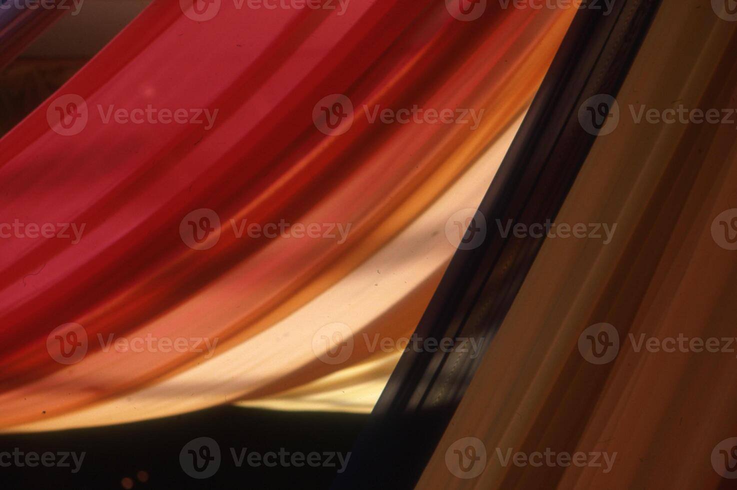 a red, yellow, and blue curtain photo