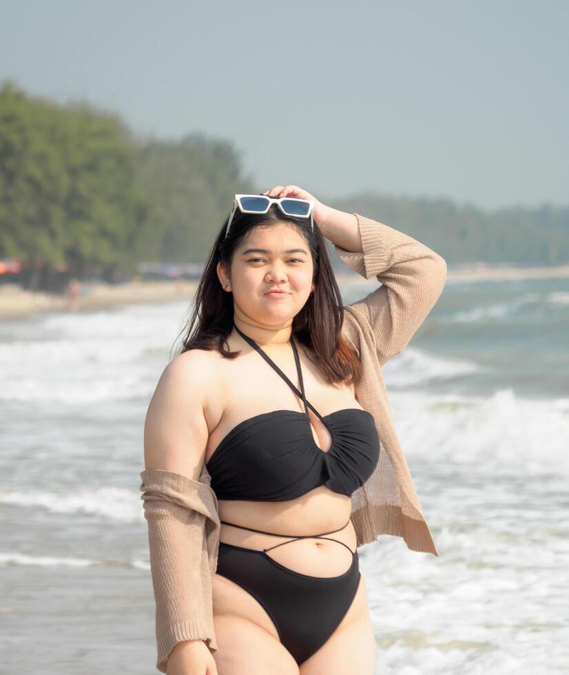 glamorous girl in bathing suit with big breasts and glasses