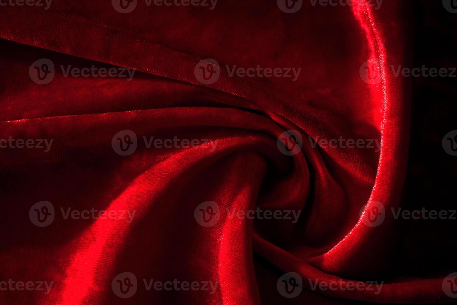 Abstract background made of red velvet fabric. photo
