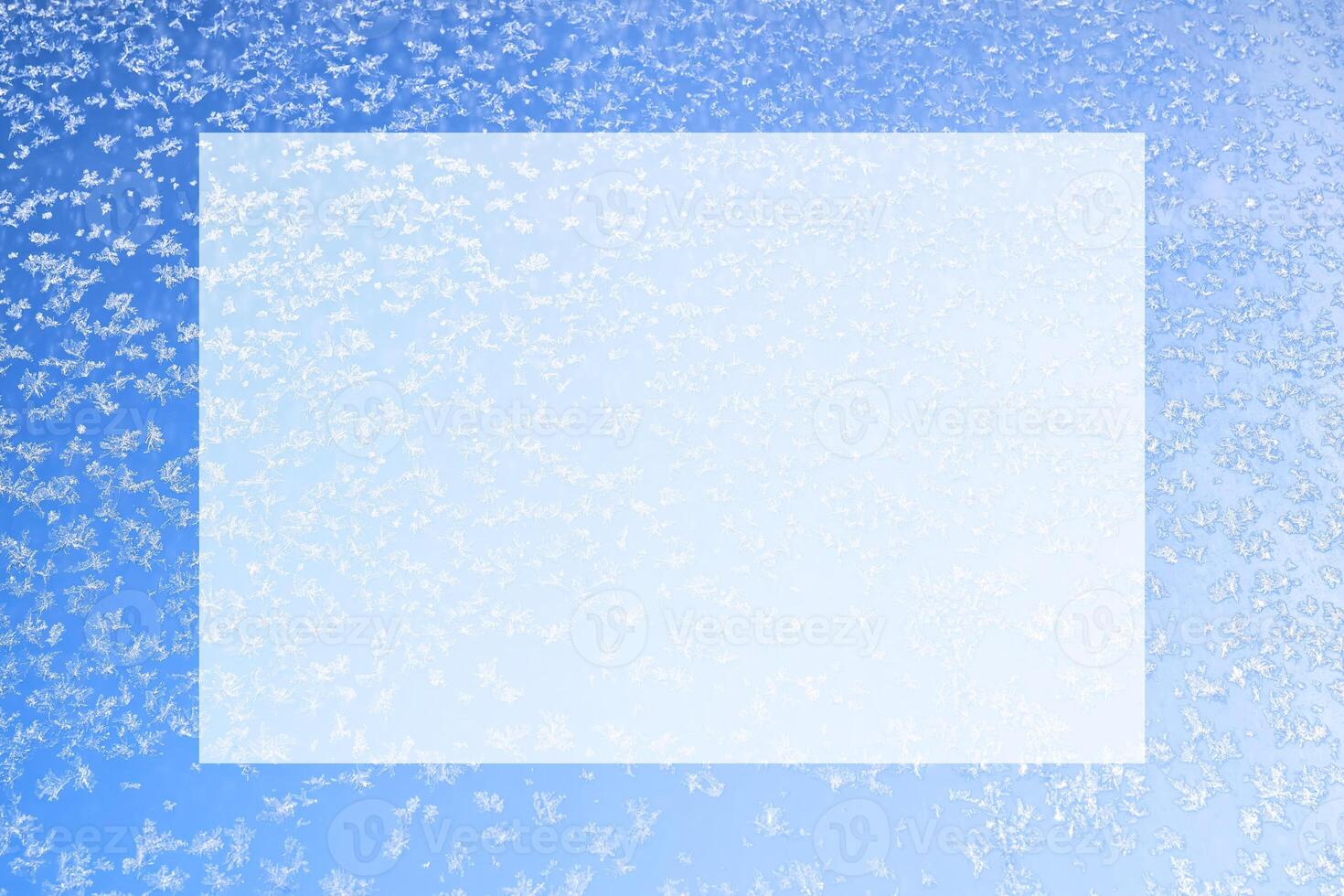 Abstract winter background. Frost on a frozen window against the blue sky. photo