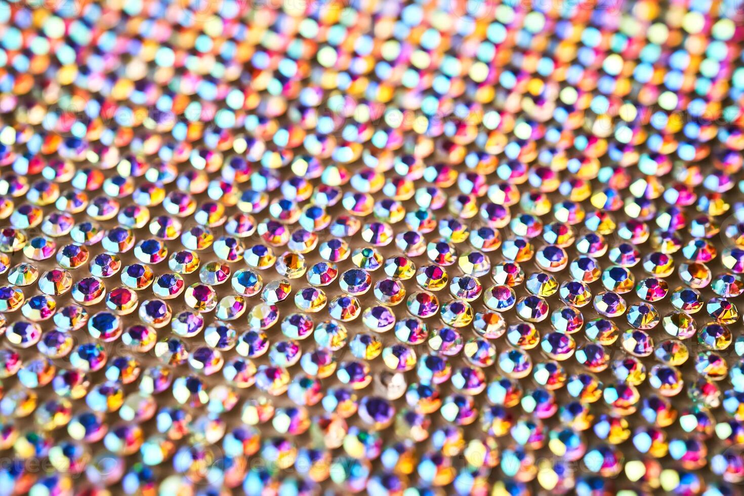 Abstract background made of rhinestones shimmering in the light. photo