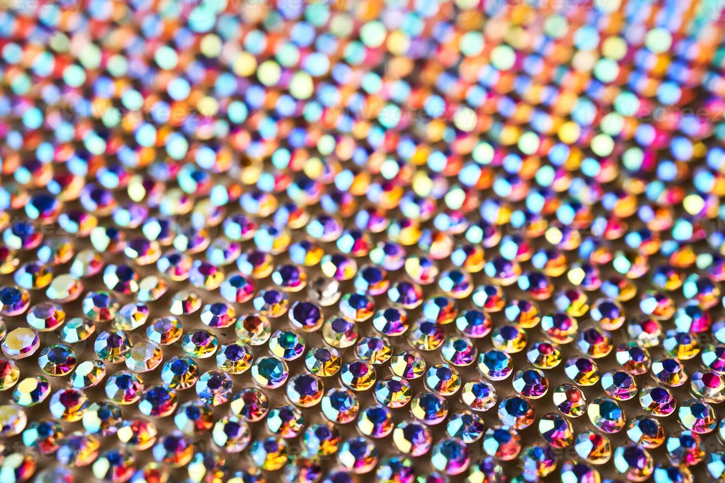 Abstract background made of rhinestones shimmering in the light. photo