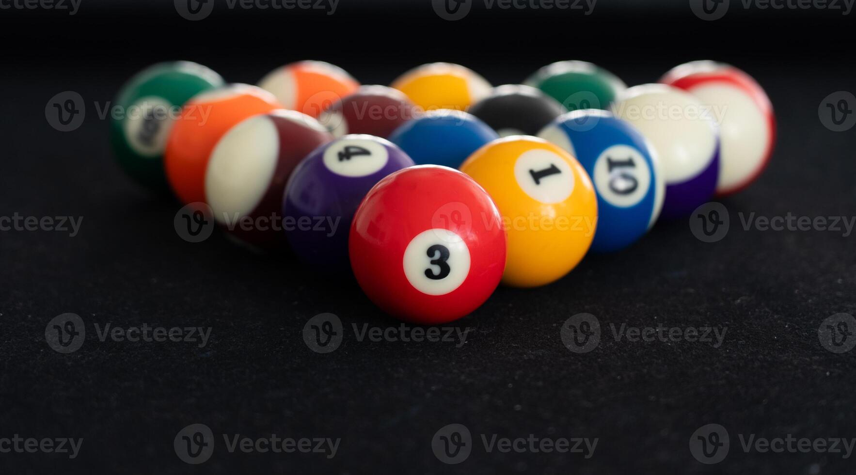 Close up View of Man Playing Pool Table photo