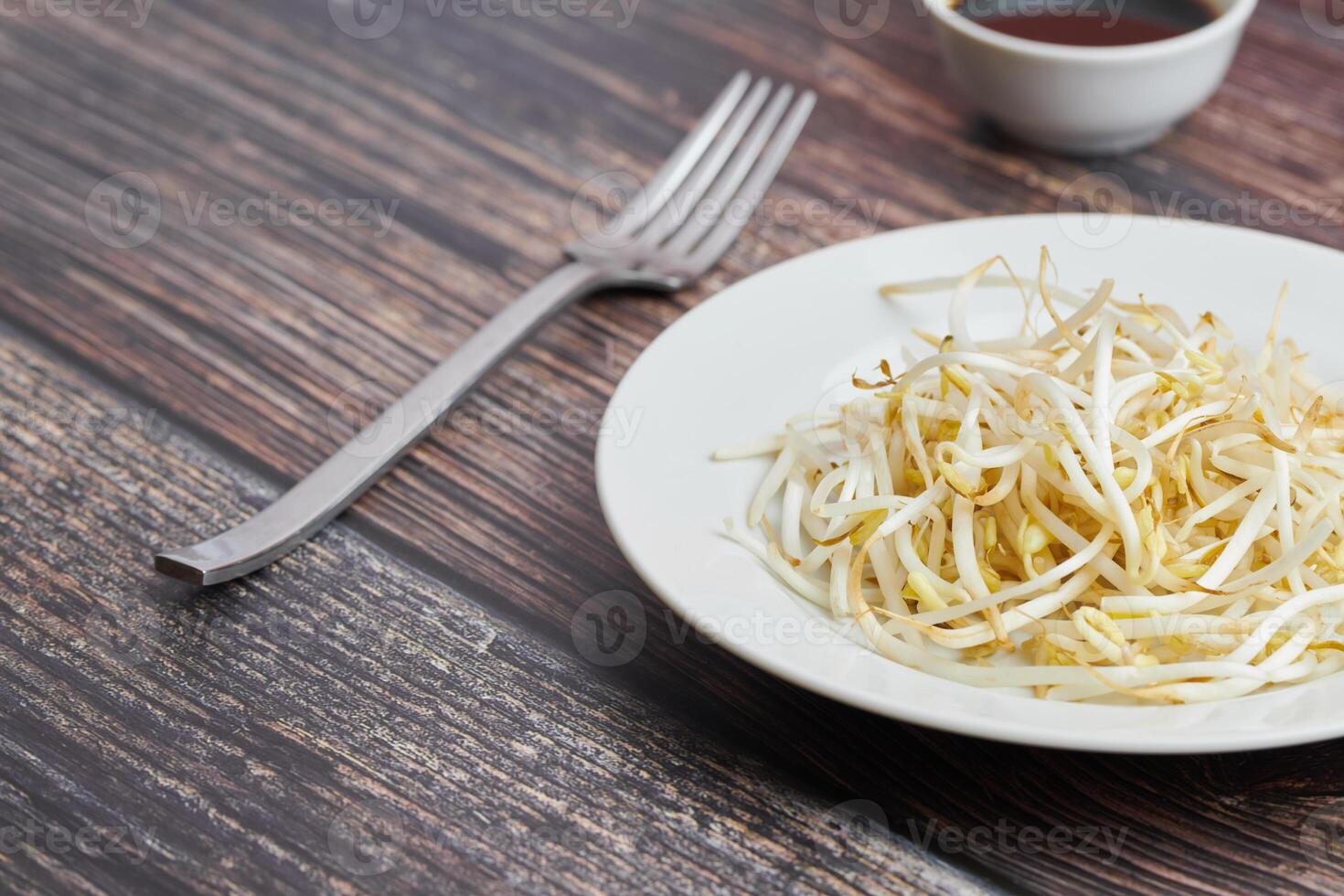 Bean sprouts of mung, maash. Traditional vegan dish in east Asia. Healthy diet food. photo