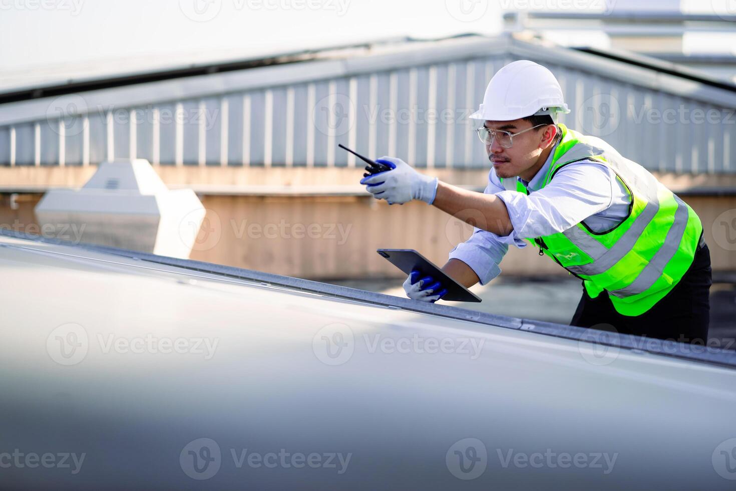 Expert engineer with laptop checking maintenance of solar panels Concept of solar energy, re.ewable energy photo