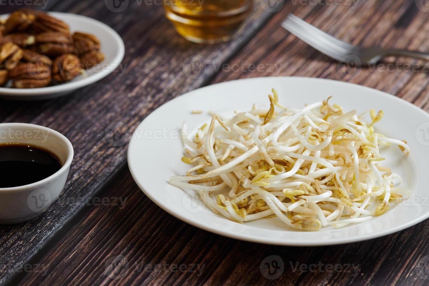 Bean sprouts of mung, maash. Traditional vegan dish in east Asia. Healthy diet food. photo