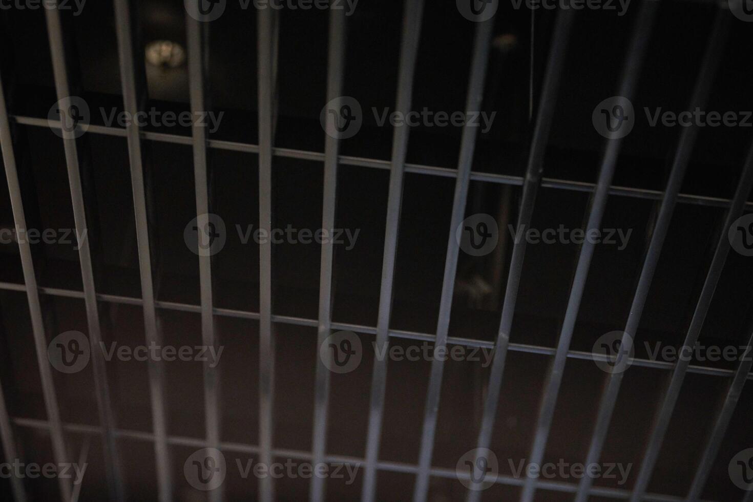 Office grille ceiling. Modern black metal grille ceiling, suspended covering. Abstract design texture. photo