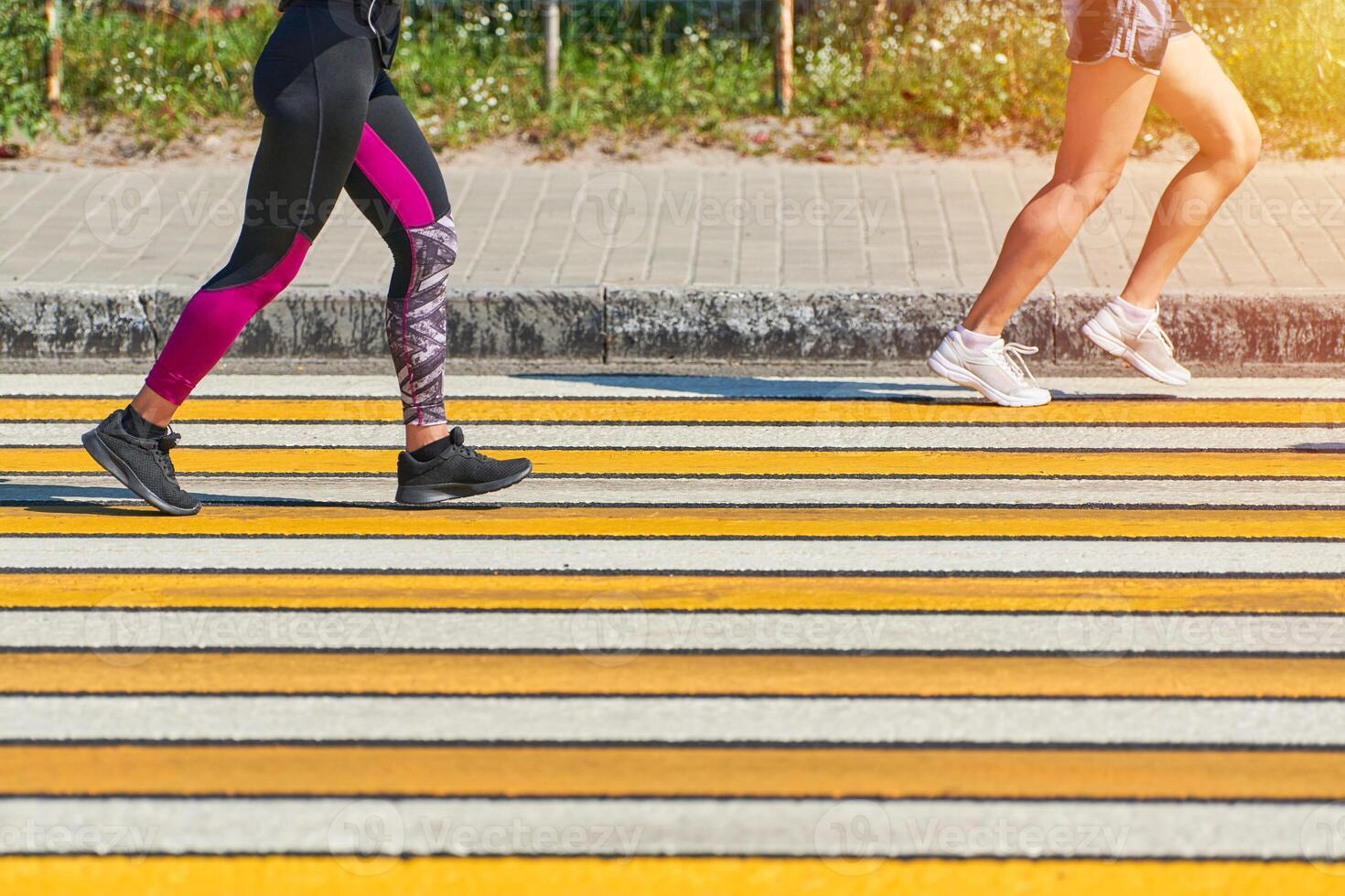 Woman running crosswalk, copy space photo