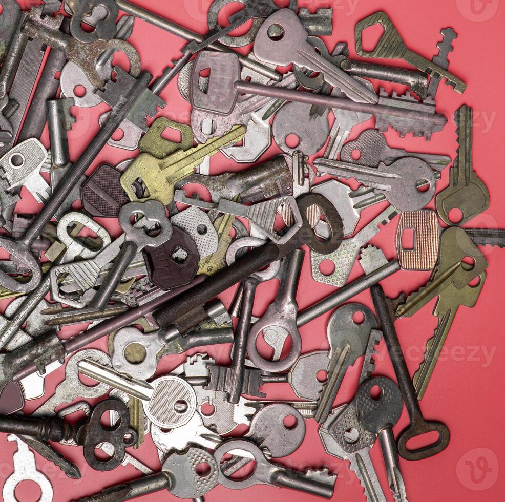 Keys set on pink background. Door lock keys and safes for proper photo