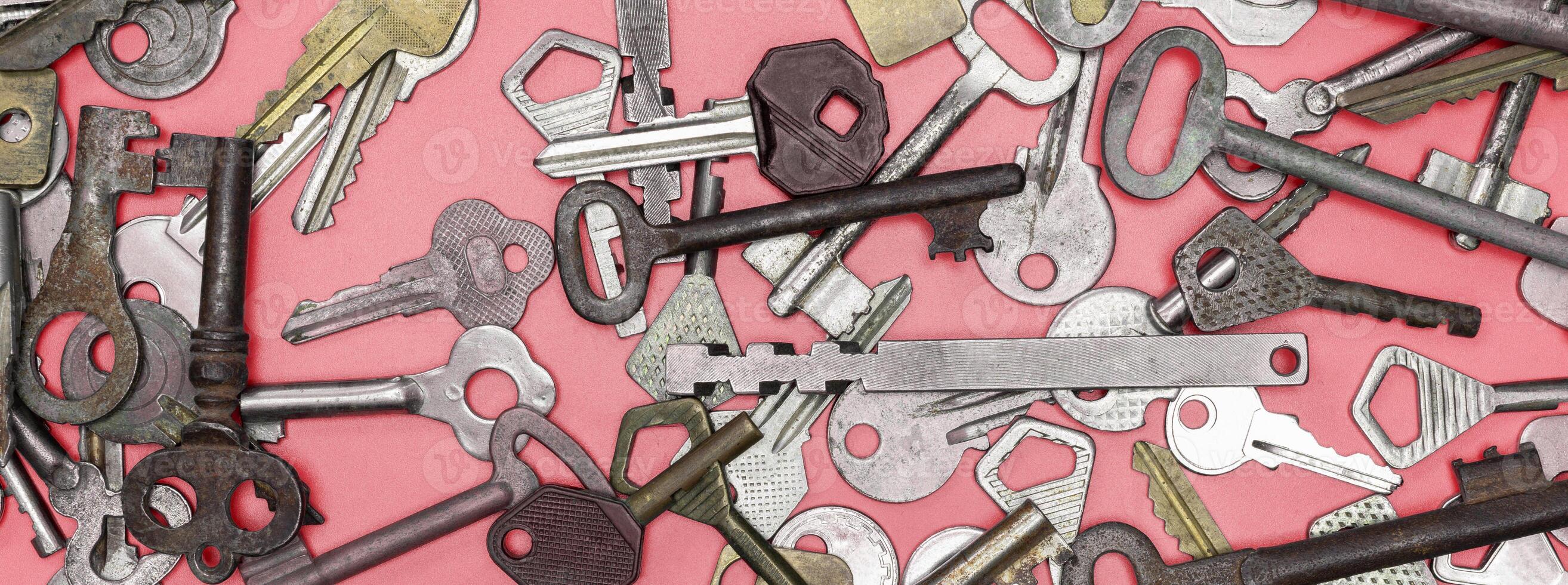 Keys set on pink background. Door lock keys and safes for proper photo