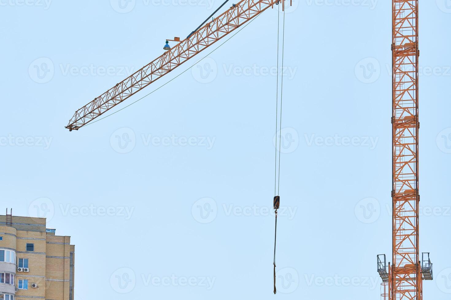 Construction crane working on building complex photo