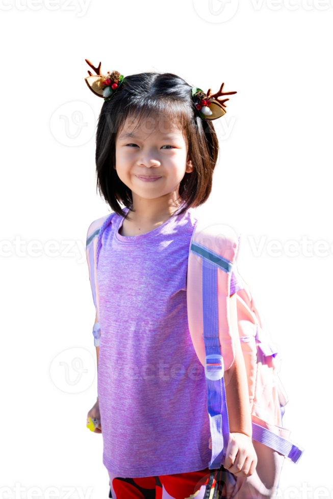 Happy Child Girl wearing reindeer hairpin and carrying backpack, ready for festive school day, Isolated Background. Smiling Asian Kid with Brown Reindeer Hairband to get into Christmas festival. png